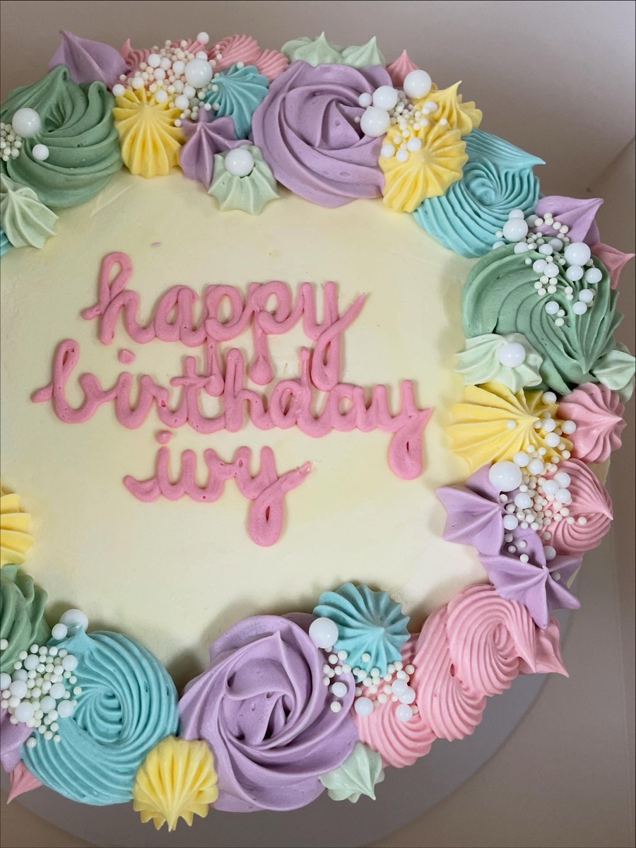 Colourful pastel birthday cake with rainbow buttercream