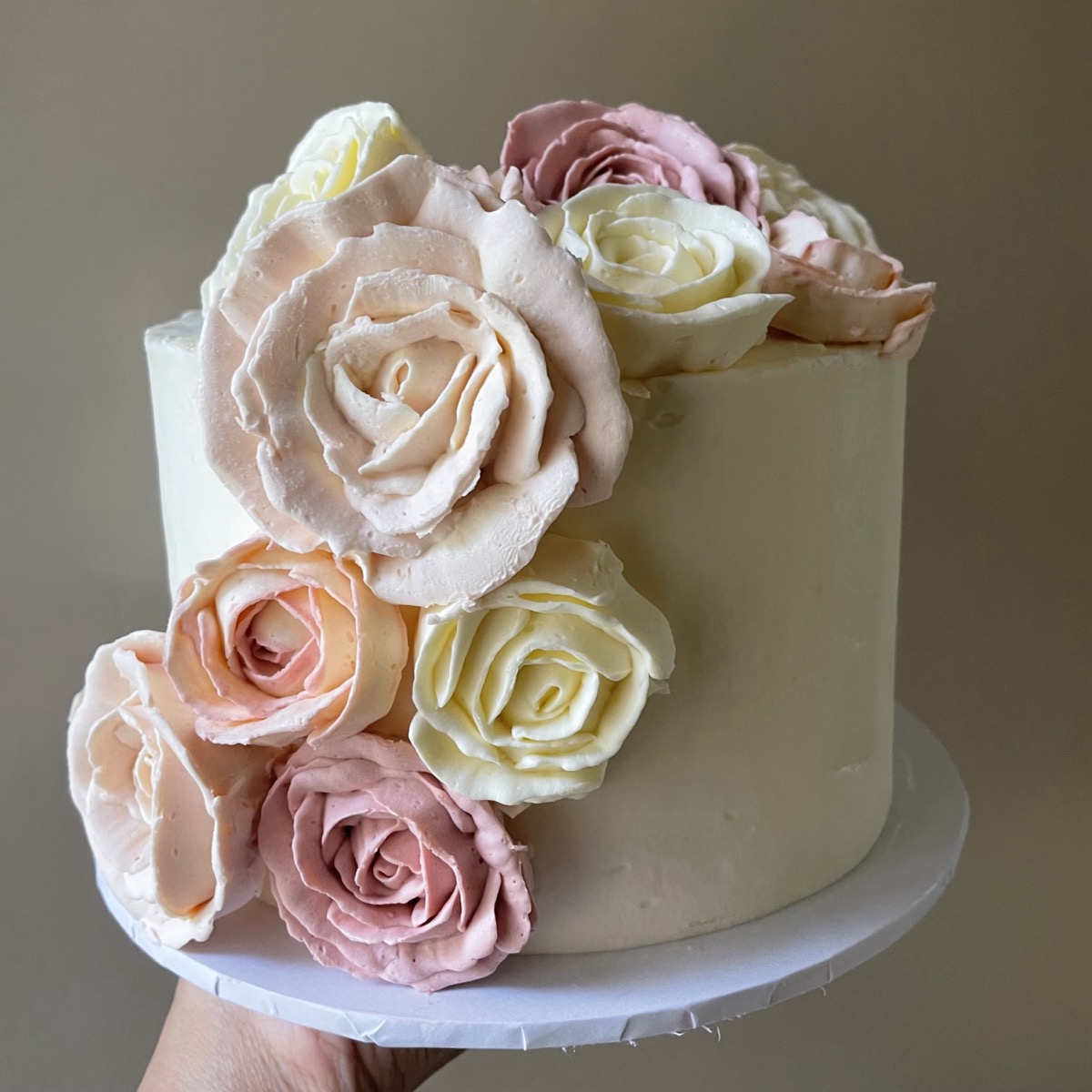 Beautifully decorated buttercream cake with roses