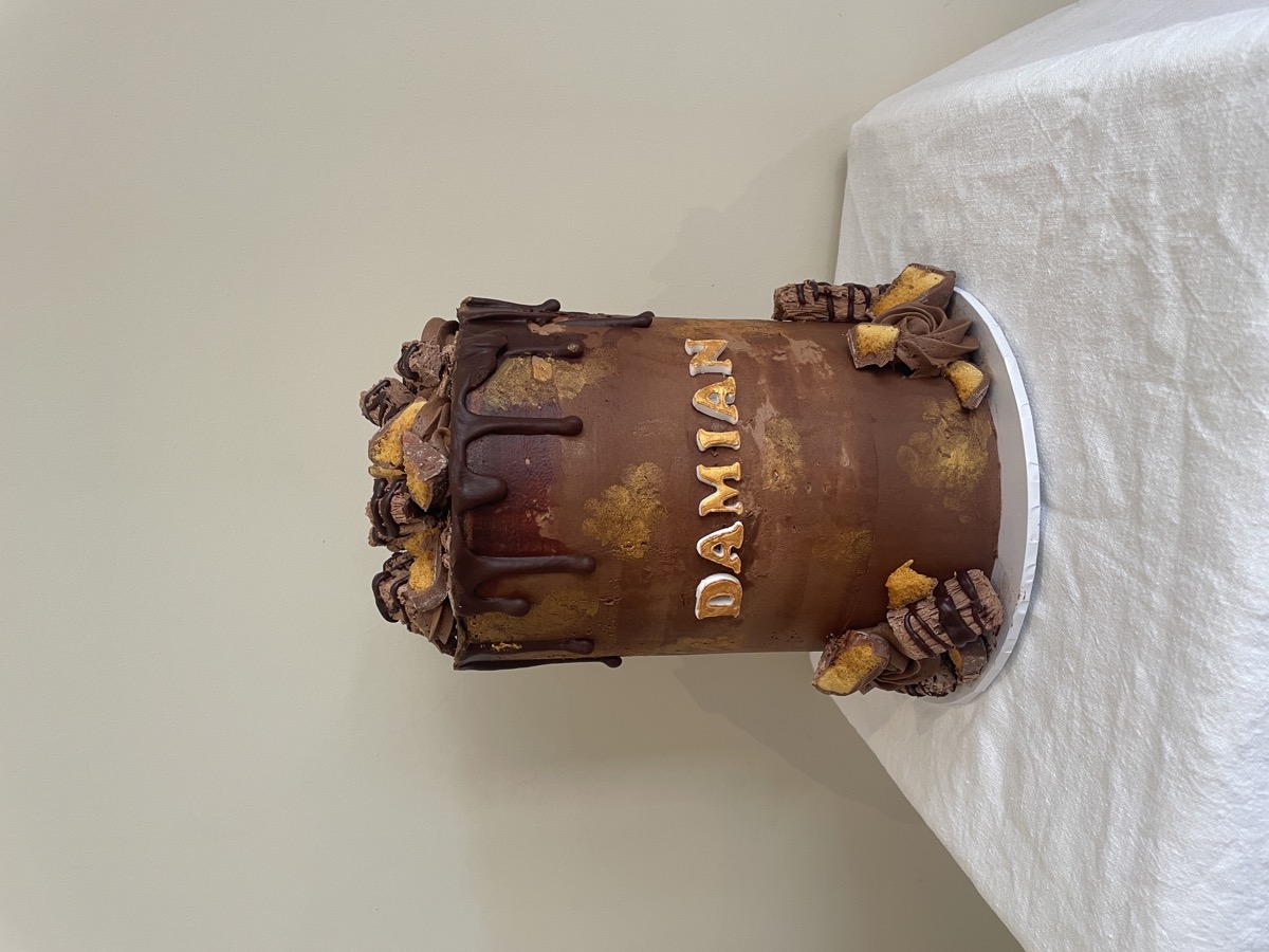 Chocolate drip cake with gold accents
